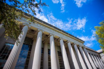 columned building against blue sky